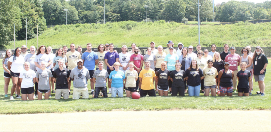 Coaches%2C+players%2C+and+faculty+members+line+up+for+a+Faculty+Athletic+Mentor+%28FAM%29+photo+on+Panther+Field+following+the+kickball+game+last+Friday.