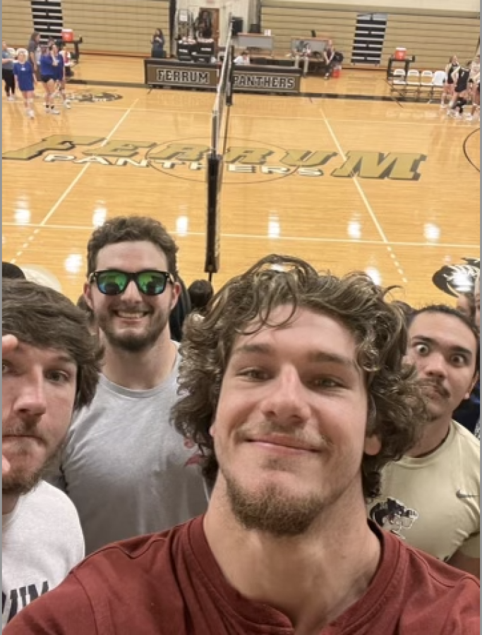 From left, Zach Smiley, freshman; Noah Smiley, freshman; Connor Sides, junior; and Kenneth Lokie, freshman, take their selfie at a volleyball game to earn points.