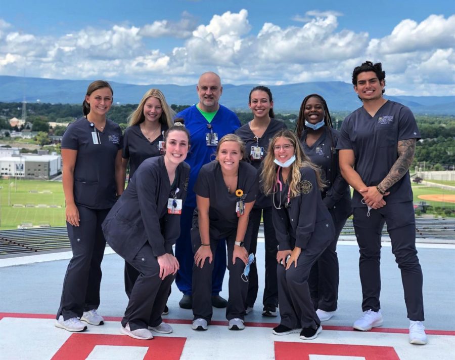Front row from left: Megan Allen, Kaetlyn Sluss, Caitlyn Reaves.
Back Row L-R: Skyler Swaney, Autumn Overfelt, John Phillips, Jenna Lambert, Kavion Hayes, Michael Lopez. 
Assistant Professor John Phillips and the senior nursing class visited the Carilion Clinic Heliport at Carilion Roanoke Memorial Hospital during their clinical experience on Monday, September 12, 2022.  The helipad measures 80 X 80 at an elevation of 1112 and receives 150 helicopters per month.