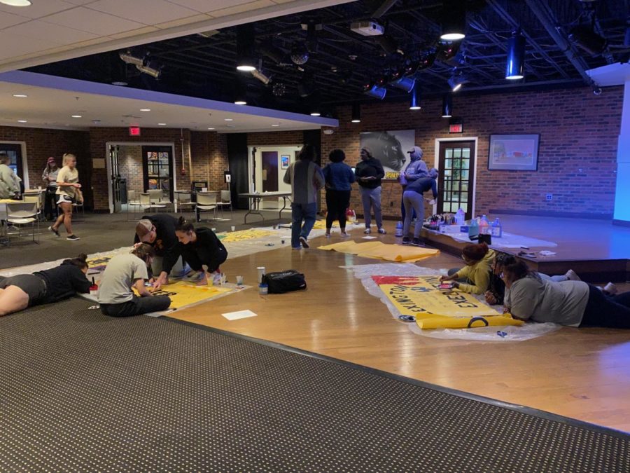 Different clubs and organizations create banners in the Panther’s Den during Homecoming Week.