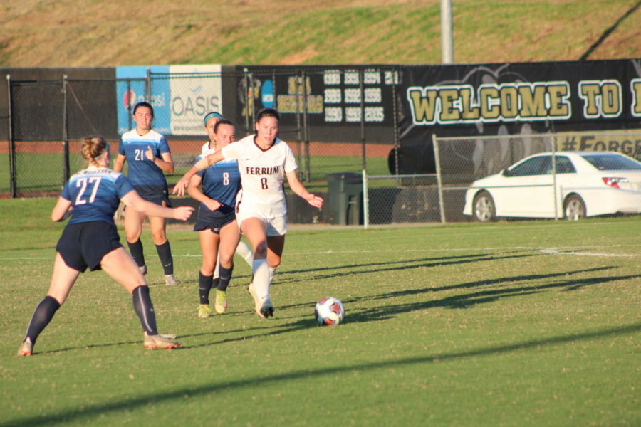 Freshman Sydney Miller, 8, breaks away from a North Carolina Wesleyan defender en route to a 3-0 Panther victory.