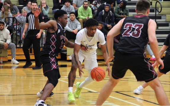 Tahli Oden, junior, works the ball against Roanoke College.