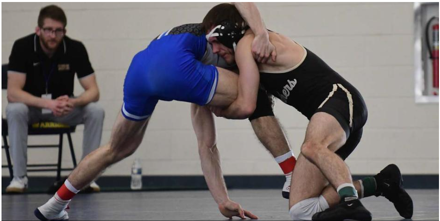 Ferrum College senior, Christian Hite makes a move against a Shenandoah wrestler.
