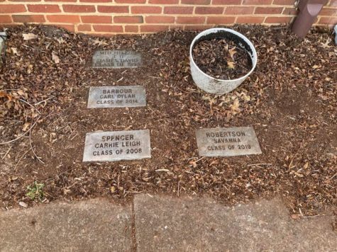 The memorial garden at Franklin County High School in Rocky Mount memorializes passed students with simple, understated stone markers.