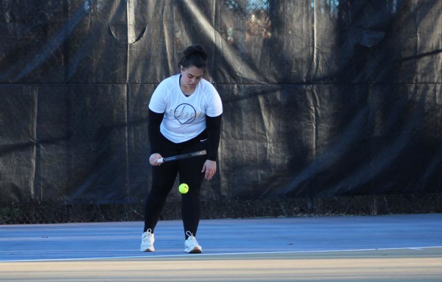 Gabby Mendoza, junior, won both her singles and doubles matches against Peace.