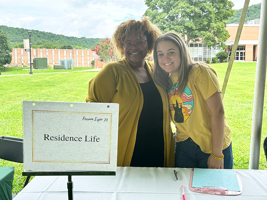 Coordinator of Residence Life Lacey Matthews, left and sophomore Kolby Snow at the 2023 Ferrum College Expo