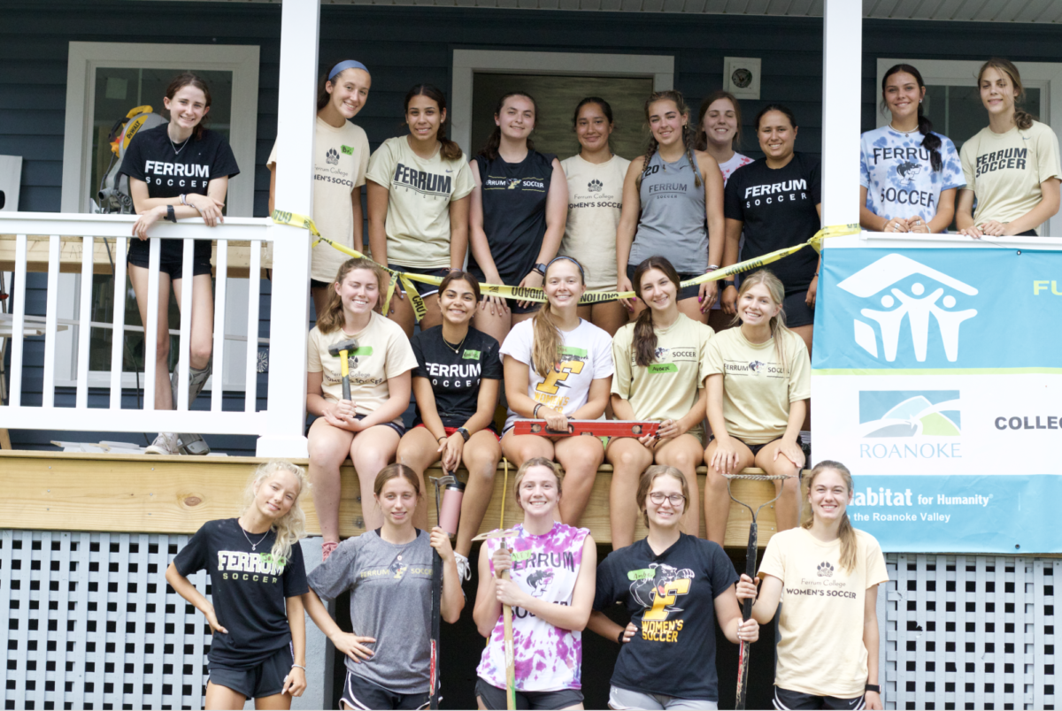 The womens soccer team takes time for a photo after spending the day on a service project for Habitat for Humanity.