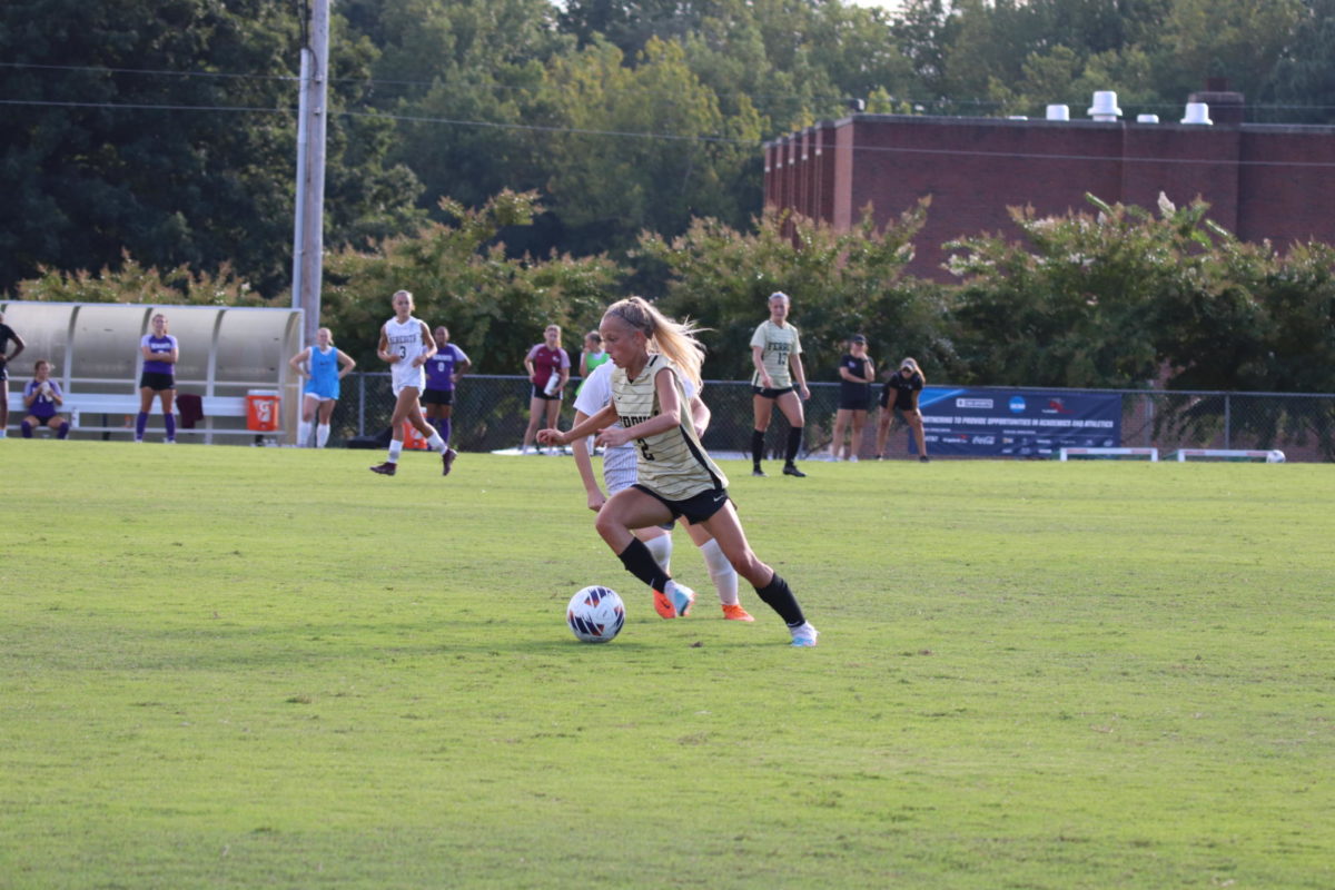 Jessie Howison, freshman, puts a move on a Meredith player. 