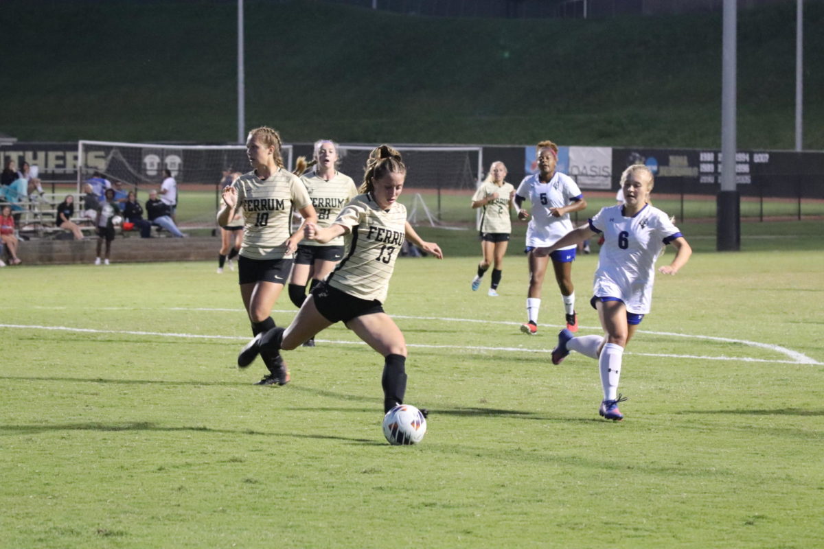 Kayla Fedison, junior, clears the ball out of the box.