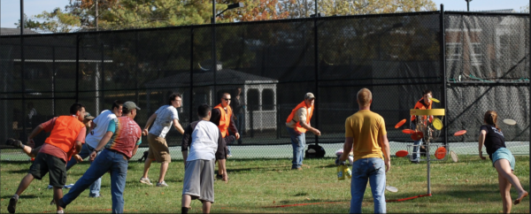 Students participate in disc golf at the colleges practice tee.