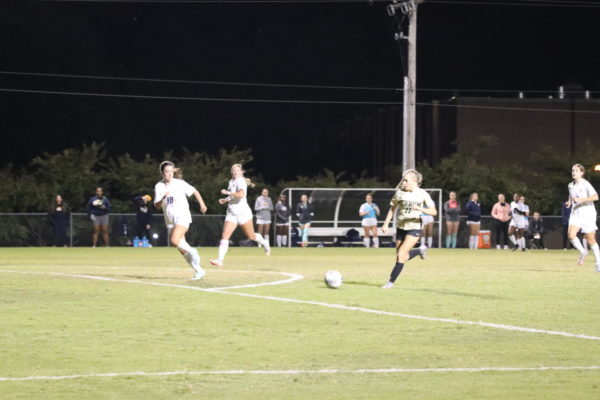 Anna Milliron, sophomore, brings the ball toward the penalty box against Averett University.