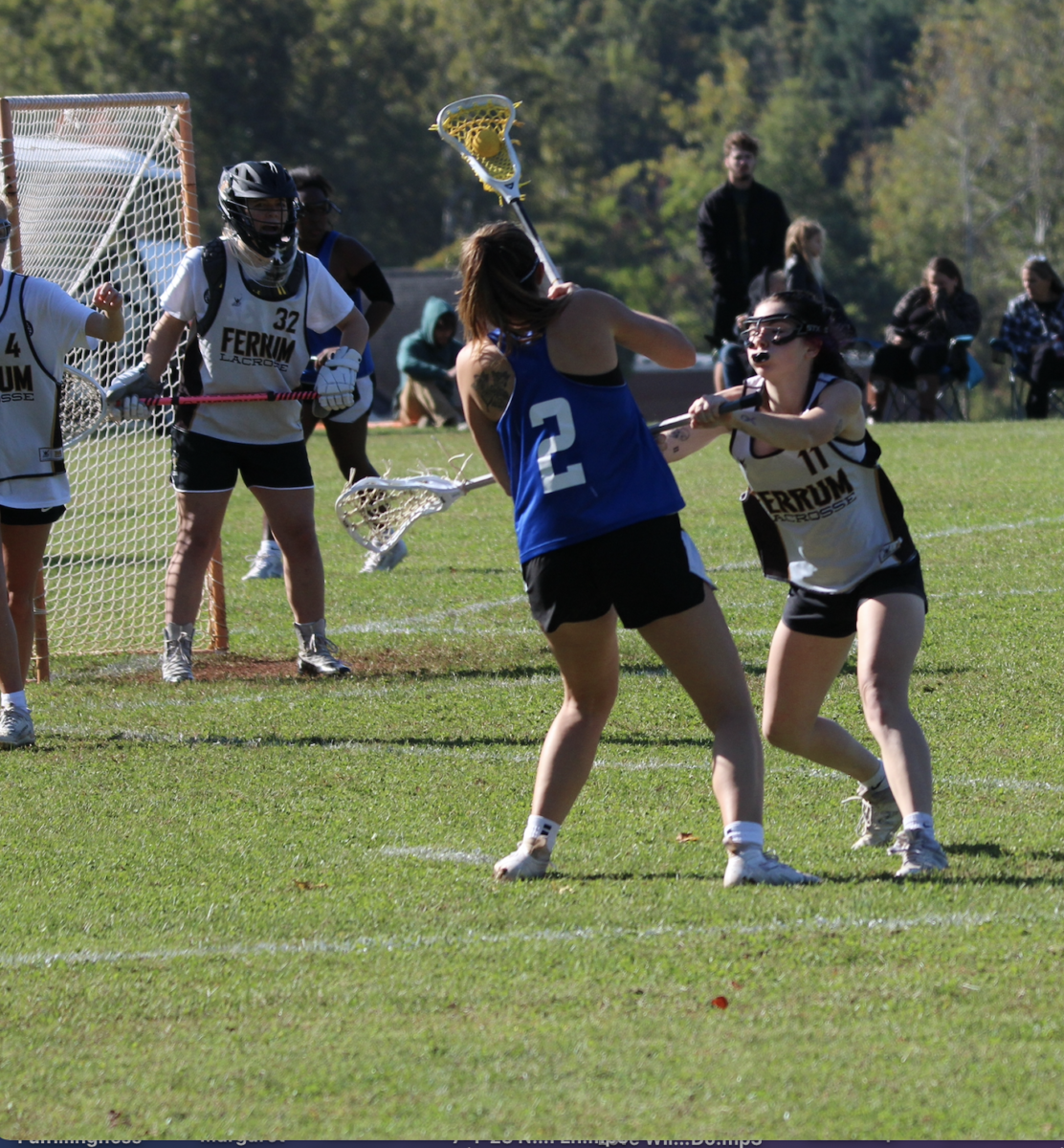 Sophomore Faith Markham, right, checks a stick into an EMU player, preventing her playing the ball. 