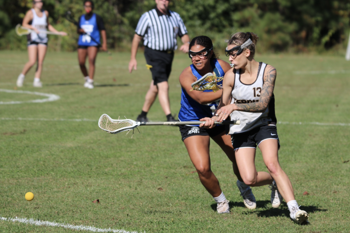 Junior Willow Cooper, right, edges out an EMU defender to get to the ball.