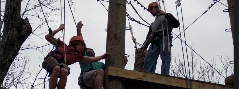 Students participate in the ropes course on campus as part of a Norton Outdoors Adventures activity. 