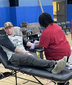 Kristian Barcroft, sophomore, gets blood drawn from his arm at the Halloween Blood Drive on campus.