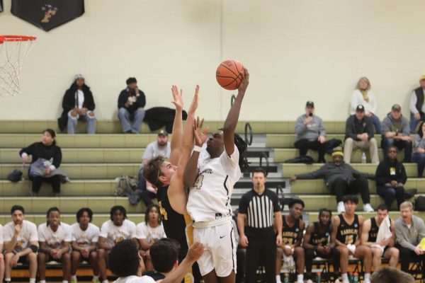 Bryant Wall, junior, goes up for two in the paint against Randolph Macon. 