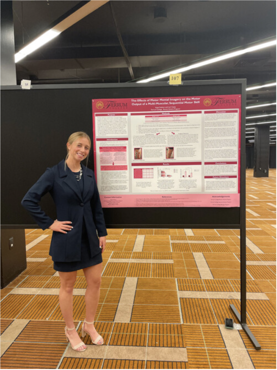 Kayla Fedison stands in front of her first place poster at NCHC conference in Chicago.
