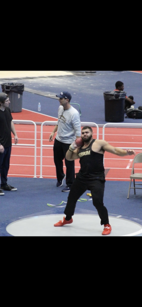 Darrian Johnson, senior, throws for a record at the Liberty Open. 