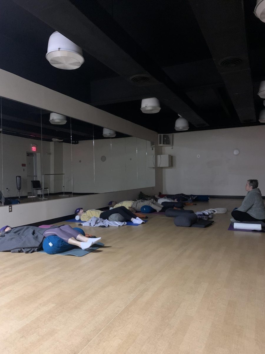 Lee ODell leads centering exercises in a restorative yoga session. 