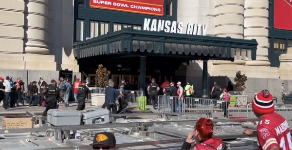 Police and bystanders disperse following the shooting at the Kansas City Super Bowl parade celebration.