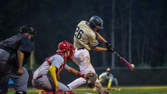 Russell Golembe, junior, smashes a hit for the Panthers.