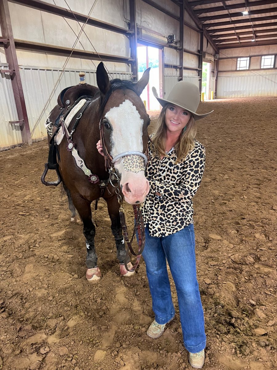 Molly Ragland poses with her horse.