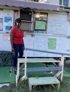 Yolanda "Poobie" Shields stands in front of the oldest food truck in Franklin County, continuing her father's vision.