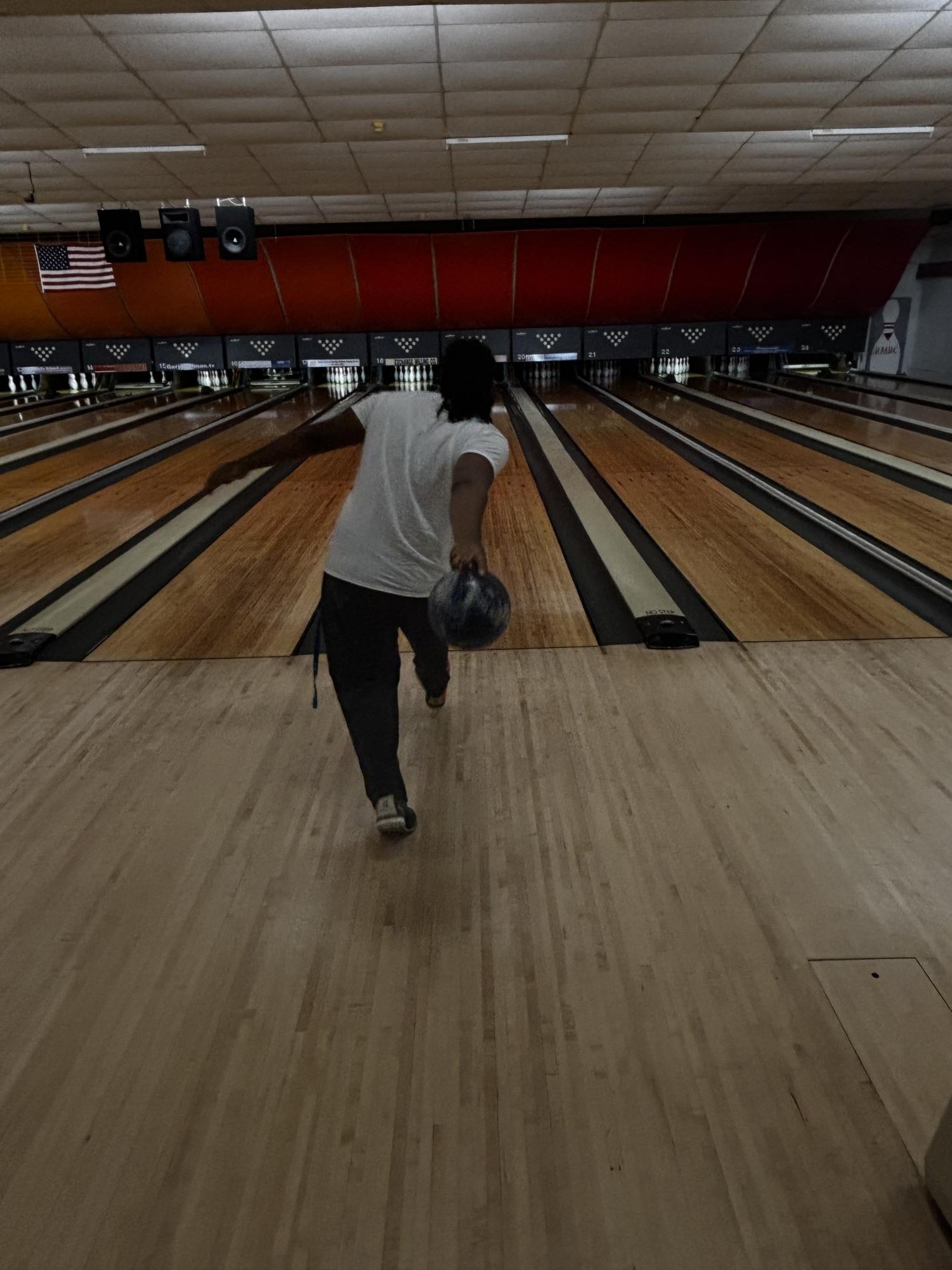 Jayce White, freshman, bowls down the lane at the Panther Takeover Bowling Night.