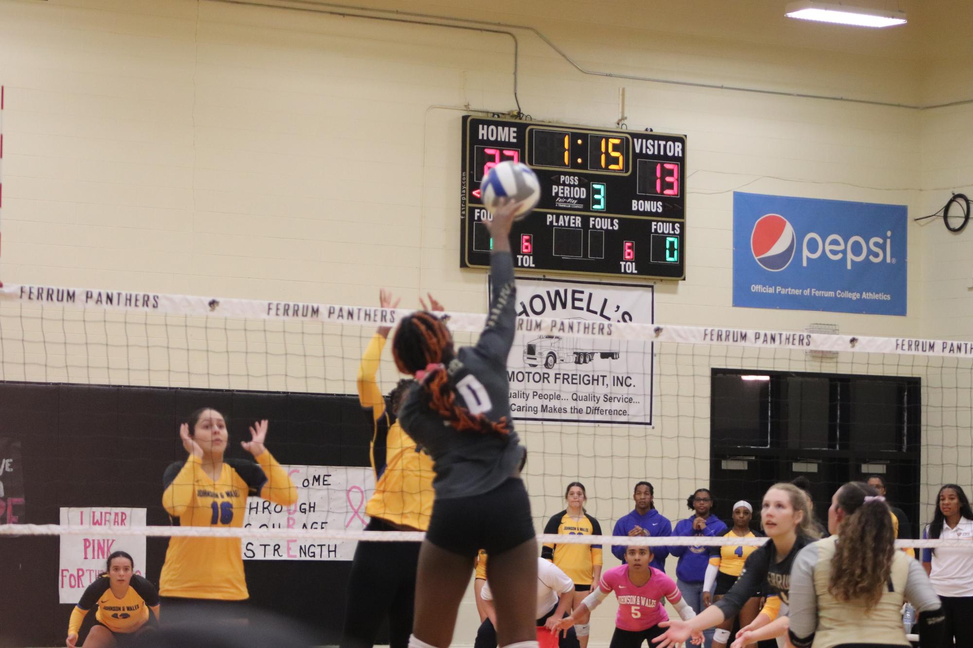 Freshman, Carsyn Diggs spikes the ball during the third set against Johnson & Wales University.