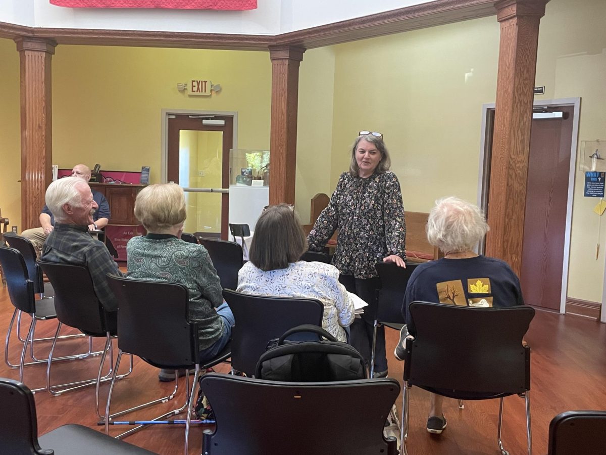 FF member Tina Hanlon chats with other members as they wait for the meeting to commence. 