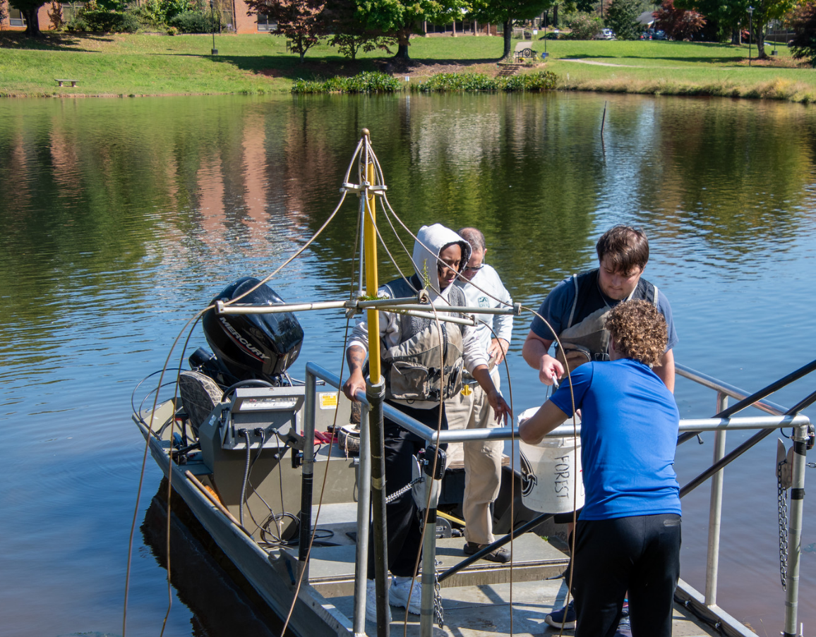 Fisheries and Wildlife students boat onto the pond during last week's electrofishing event.