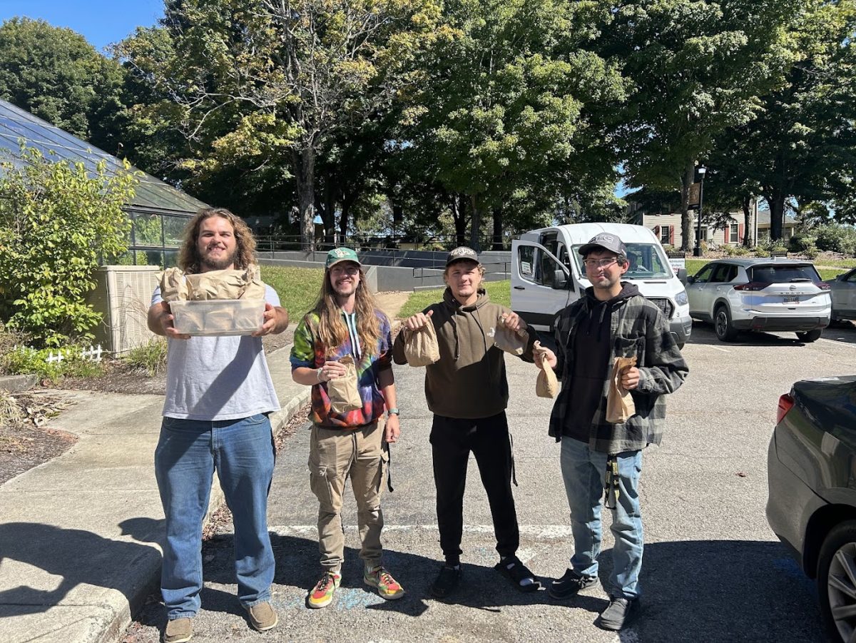 From left to right: Trent Ray, senior; Alex Reed, senior; Perry Roller, junior; Richard Marshall, sophomore; return to campus with the nuts they collected.