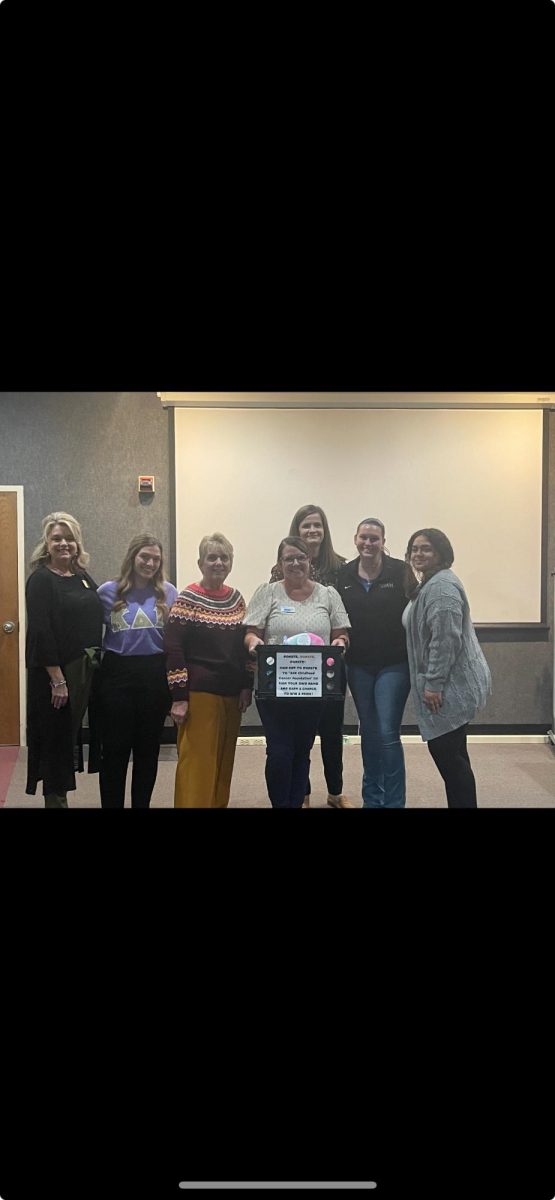 Professors and students alike gather around Educational Support Navigator Amy Fender and Associate Director of Education Alma Morgan following the tear-jerking presentation. 