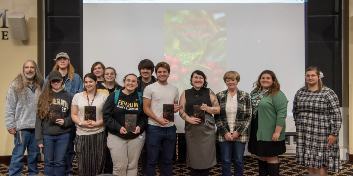 Chrysalis staff and contributors gather following the reveal of the magazine Wednesday night. 