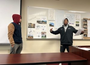 Senior Trent Proctor presents playground amenities to Friends of Ferrum Park personnel.