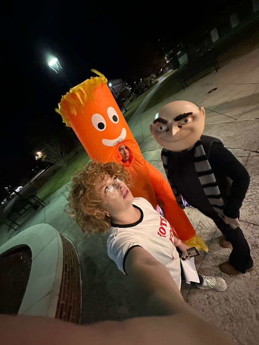 From left, Alyssa Lagomarsino, sophomore, (Napoleon Dynamite); Makenzie Williams, junior, (Inflatable Car Dude); and Hannah Williams, sophomore, (Gru); prep for the costume contest.