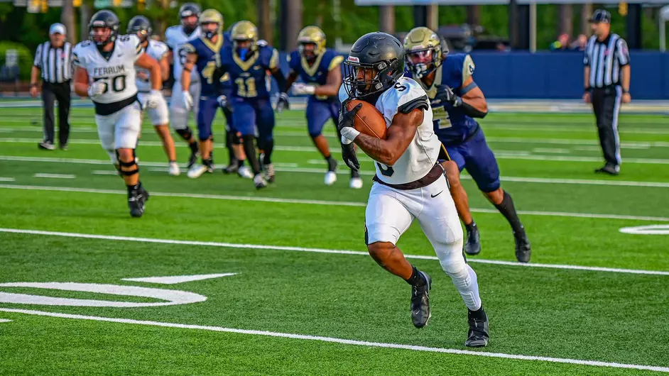 Jahylen Lee, sophomore, runs the ball during the game against Guilford.