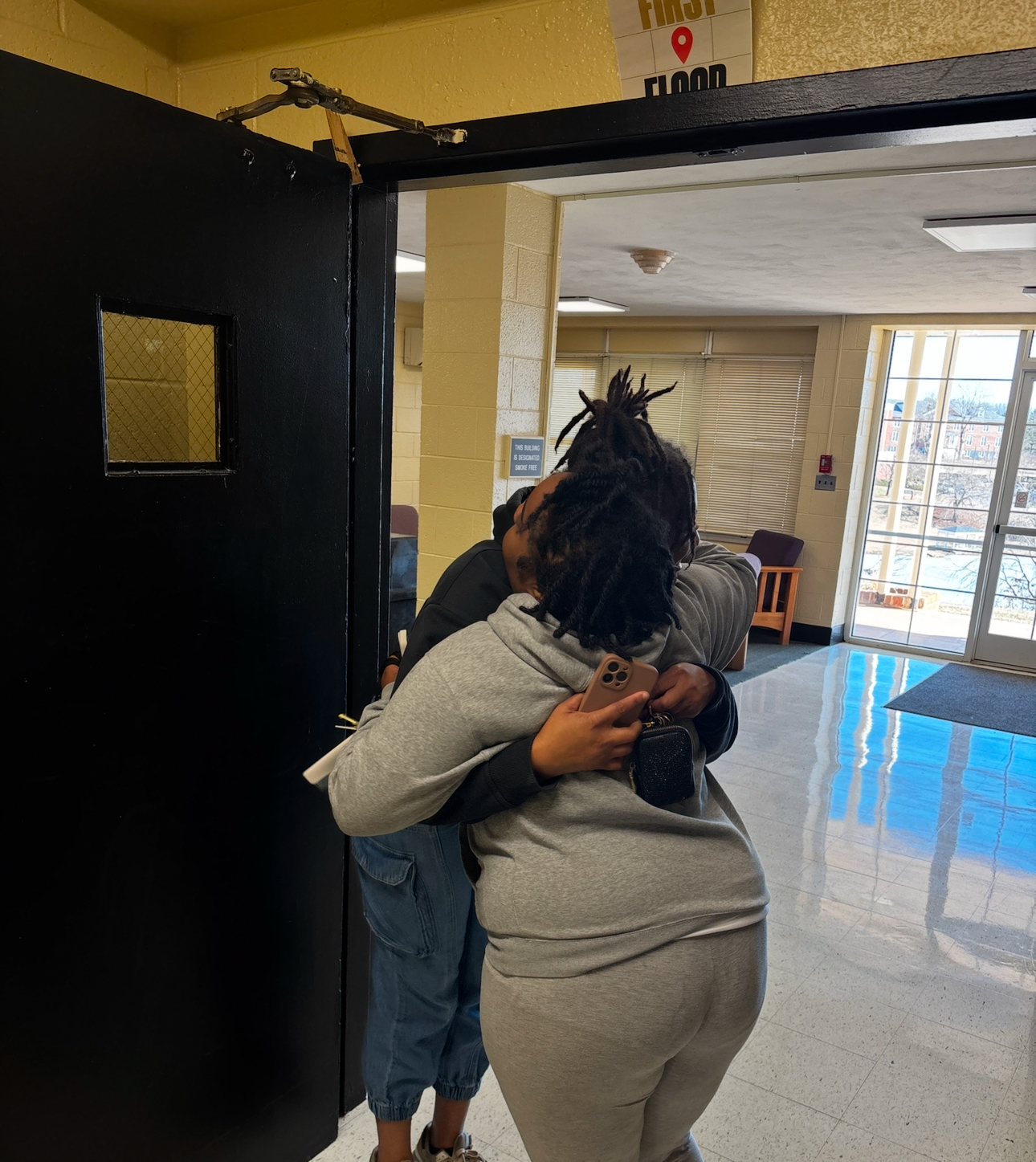 Sophomores Jasmyn Layton and Dominique Sandidge hug each other after moving back on campus.