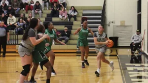 Aisha Martin, grad student, drives the ball toward the basket for a lay up.