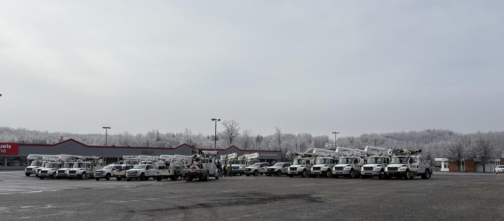 Service vehicles for Appalachian Electric Power line a parking lot in Rocky Mount as they end the day. With power outages extending across the entire county, these employees have many busy days ahead of them.