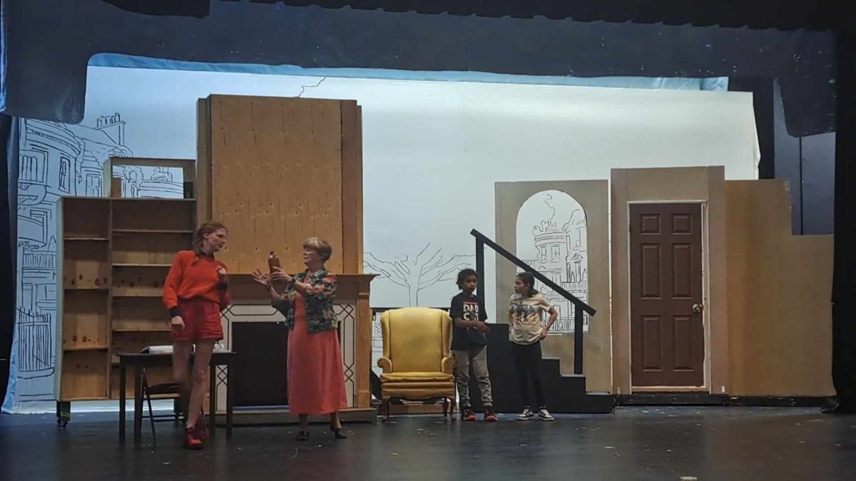 English Professor Lana Grimes-Whited, TJ Baker, Silas Henry Blankenship-Tucker, and Brystal Sigmon rehearse their lines on stage. 