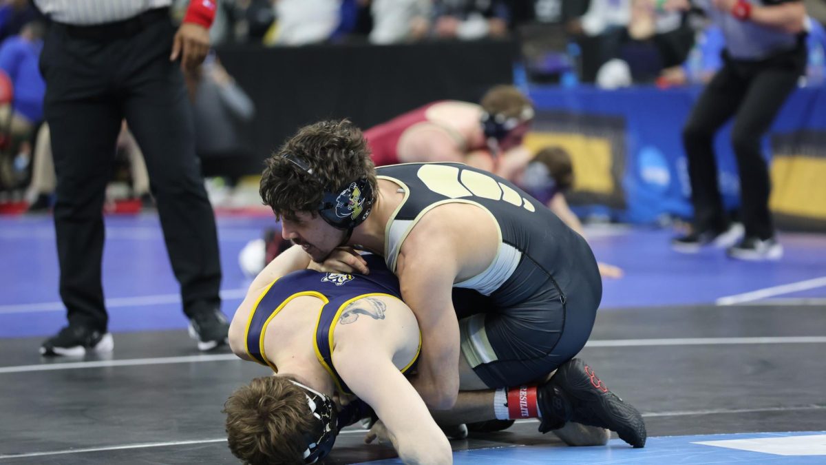 Senior Zach Beckner attempts to pin his  opponent at the D-III National Championsnips.