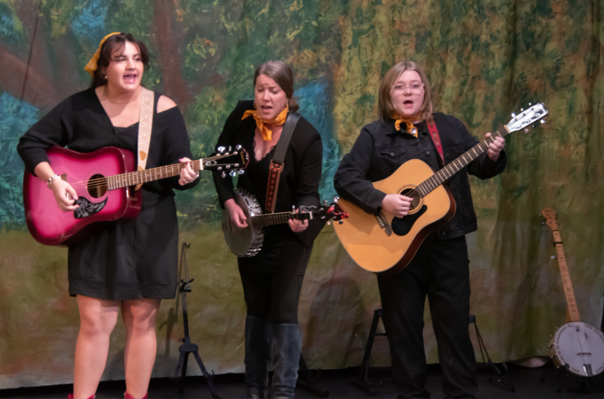 Emily Walker, senior, Rachel Blankenship-Tucker, and Ahna Tyree, junior, perform for the audience at the BFA announcement.