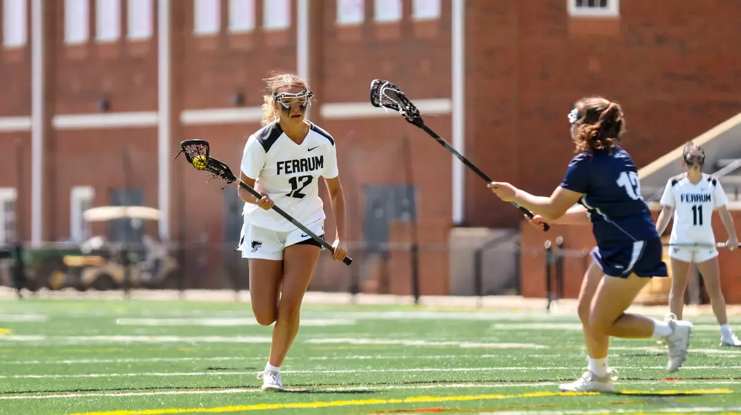 Junior Ashtyn Bishop moving the ball up the field versus Guilford
