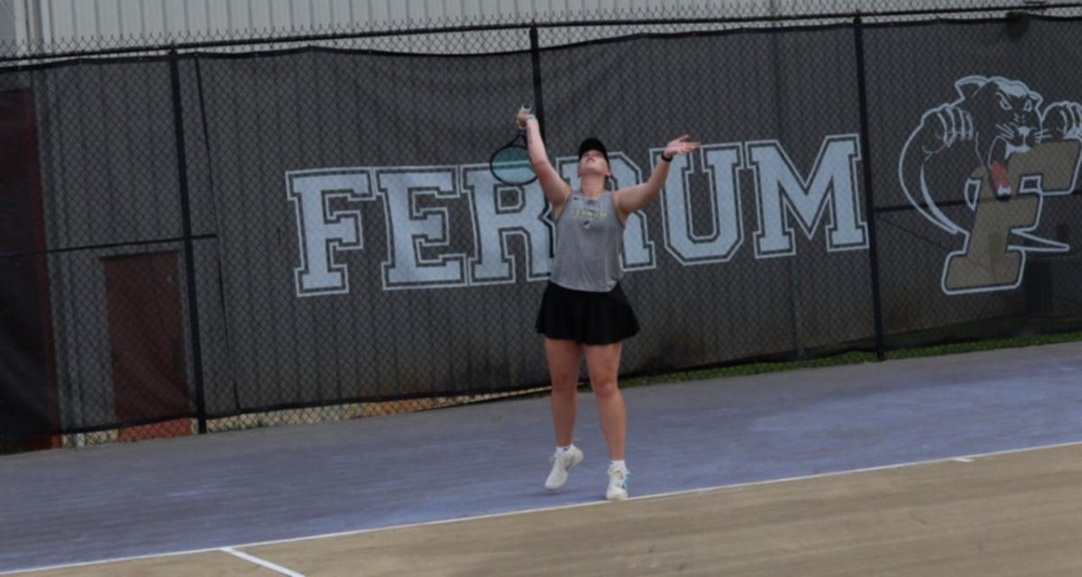 Senior Hannah Huffman serves the ball. 