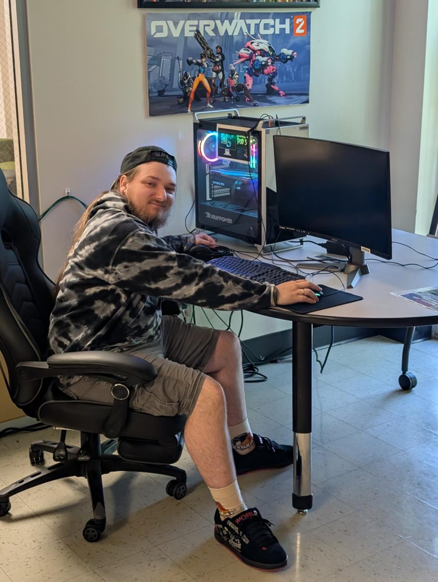 Phillip Turner, sophomore, Vice President of the Gamers Guild, shows one of the gaming PCs available for use in the studio.