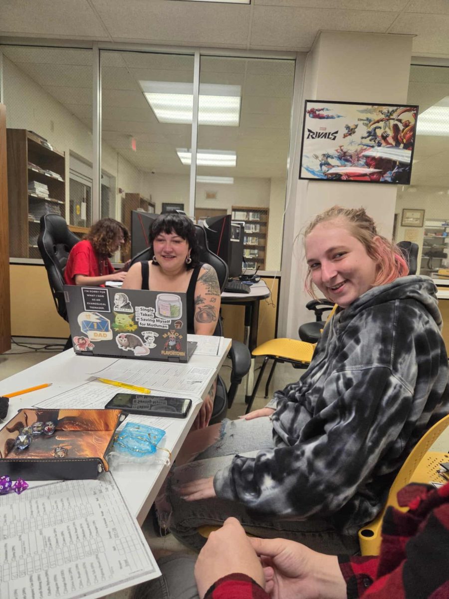 At right, Keiran Groce, senior, plays a game of Dungeons & Dragons with the Gamers Guild.