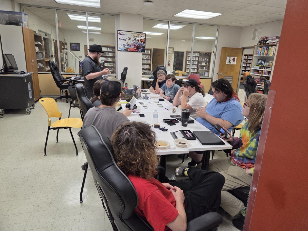 Students line a table in Stanley Library's LEaP Studio to play Dungeons and Dragons.