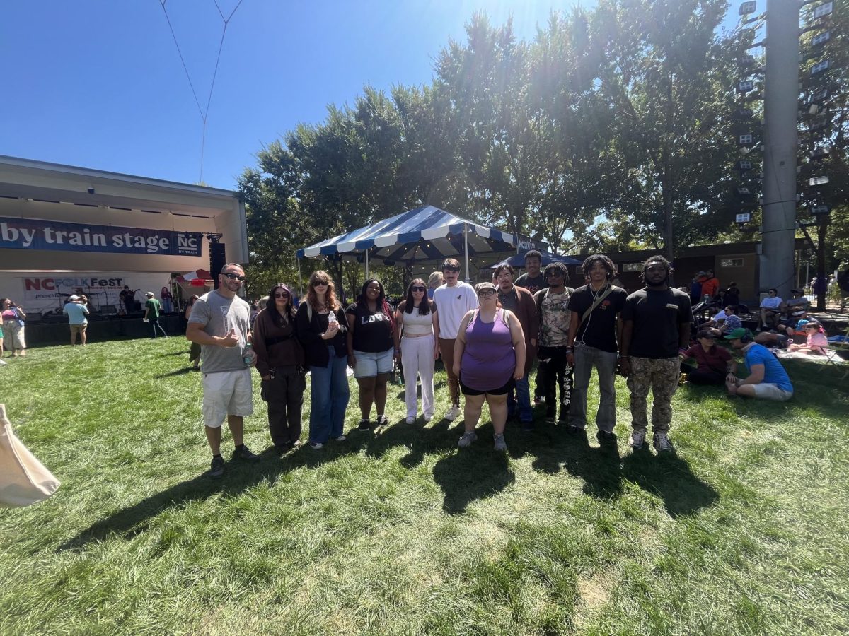 History Professor Brian Suttell, far left, stands with the group of students who traveled to the Folk Festival. 