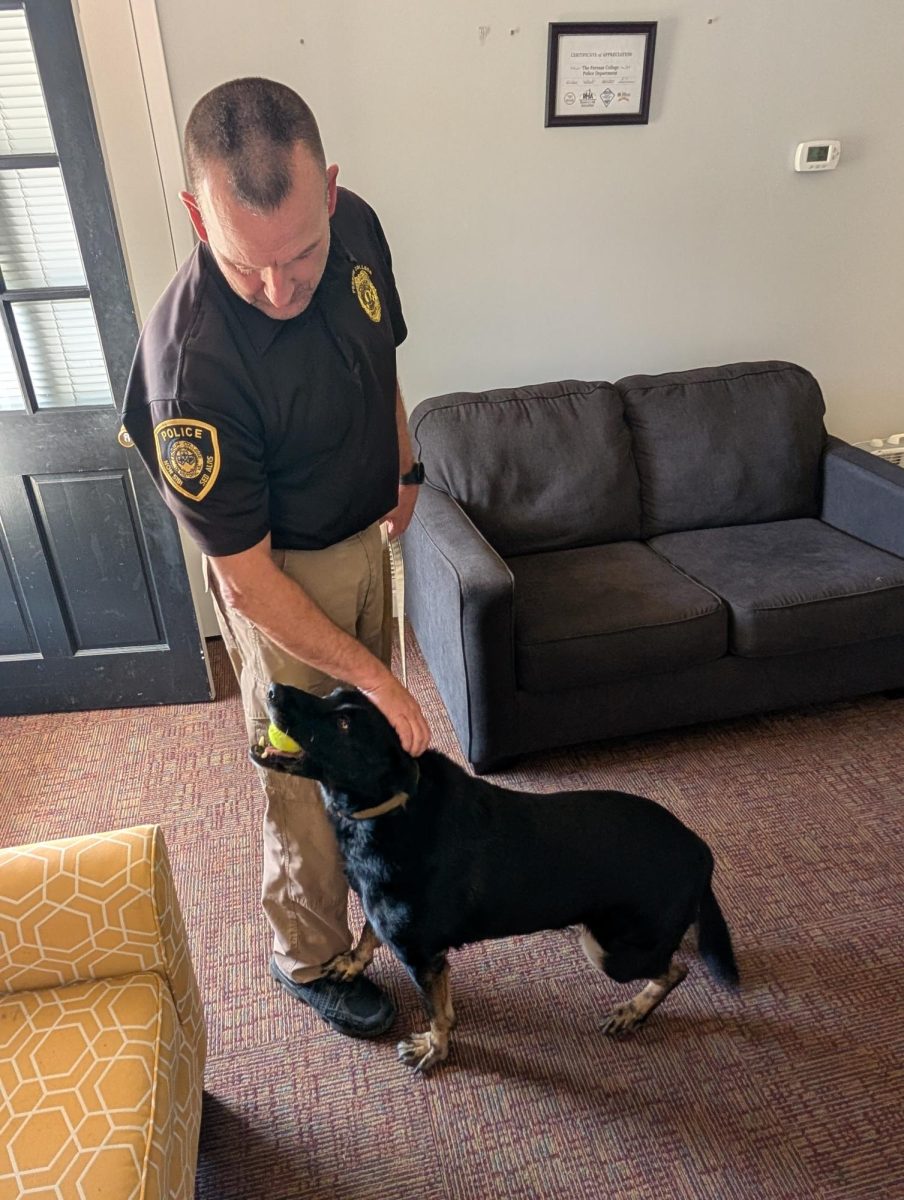 Joe Kelley, Campus Police Chief; Erika, Campus Police K9; Kelley gets Erika to stay still for a photo